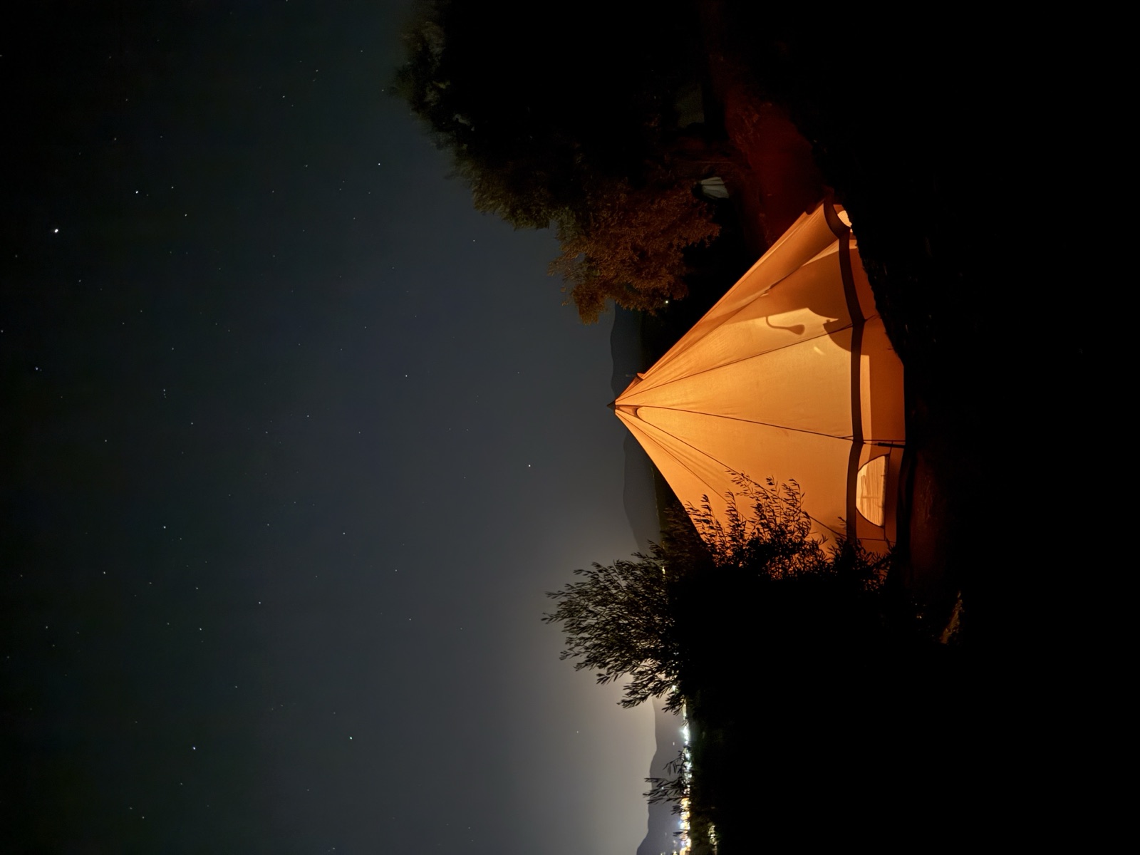 A glowing bell tent under a starry Andalusian night sky