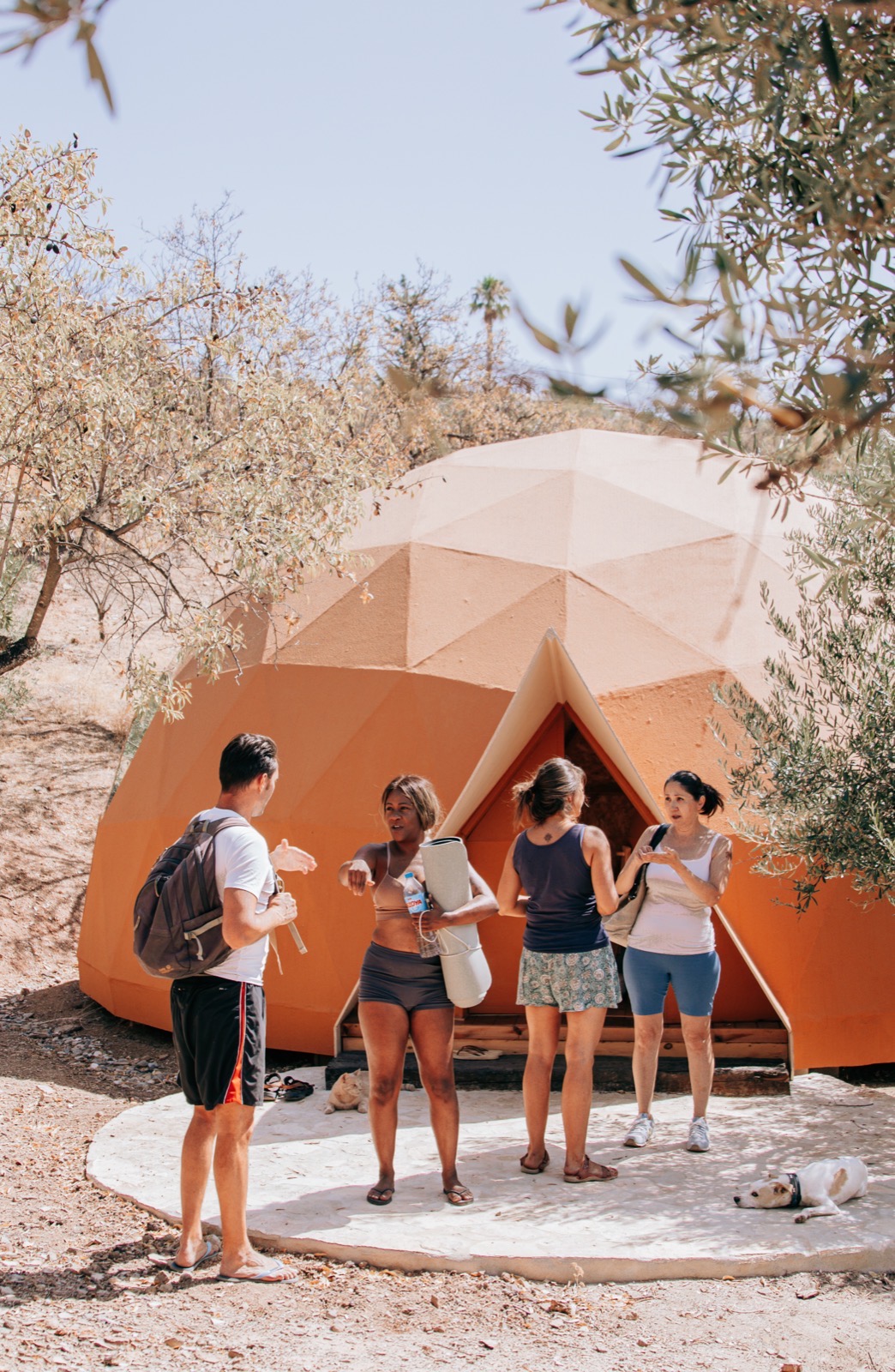 Guests gathered outside the geodesic dome before a session
